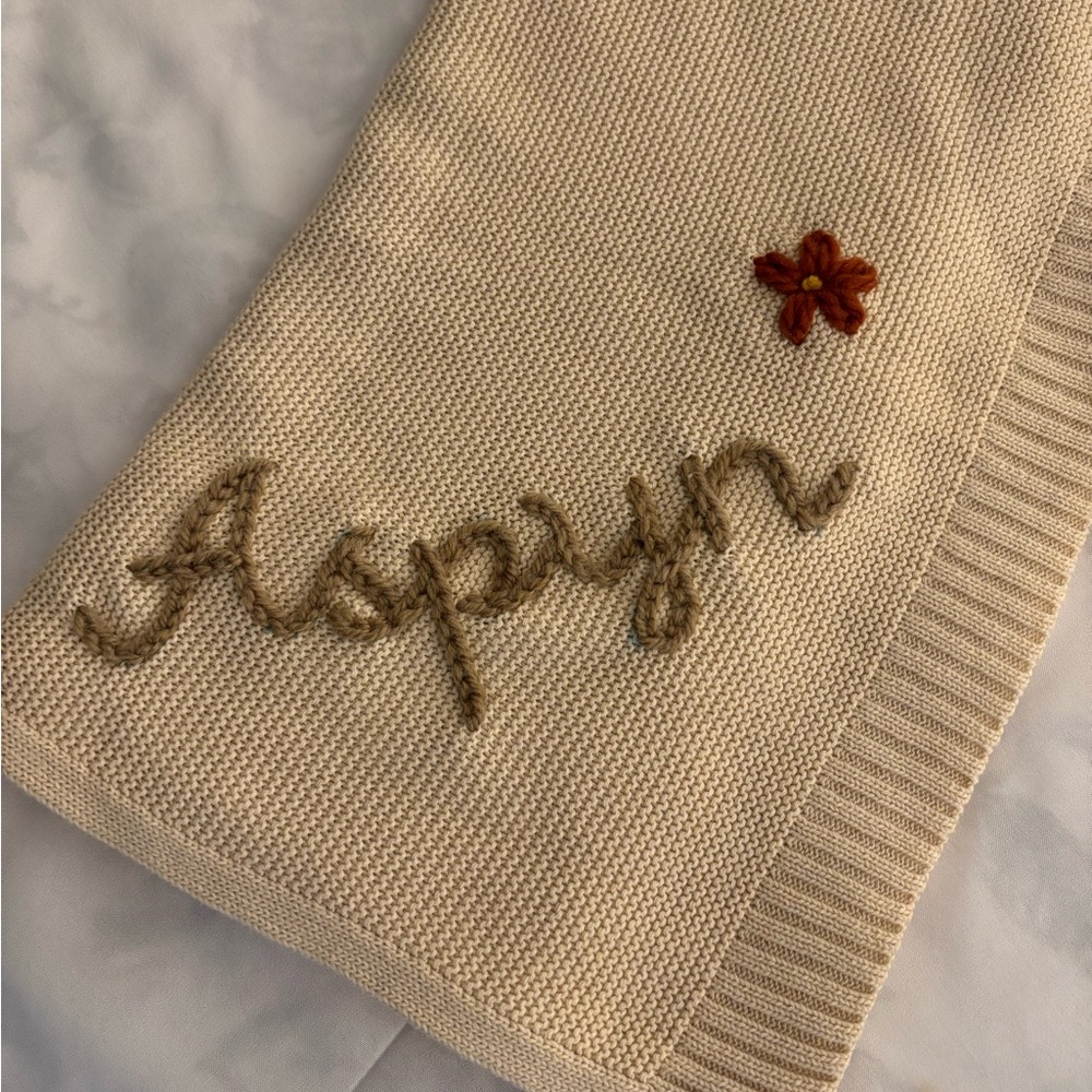 Adorable knit baby blanket. Has your daughter’s name across the corner!! Aspyn !